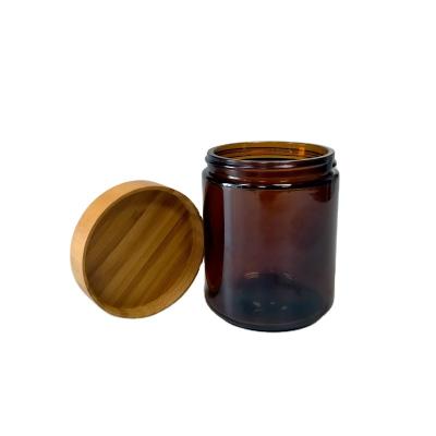 China Custom Amber Glass Candle Jar Candle Jar Laser Engraving Glass Jar For Candle With Bamboo Screw Lid for sale