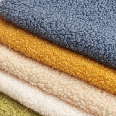 China Custom Soft Loop Brushed Single Sided Sueded Sherpa Teddy Fleece Fabric For Scarf for sale