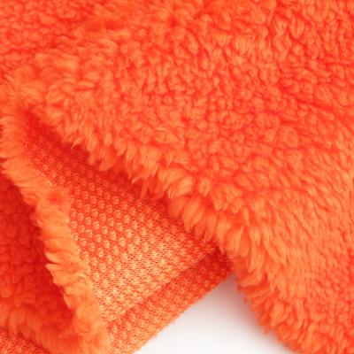 China Sueded Jihua Sunset Orange Brushed Shu Velvet Fleece Fabric for sale