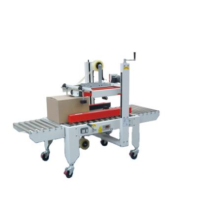 China CLOTHING YUPACK FXJ-6050B/8060B Automatic Load Type Carton Sealer for sale