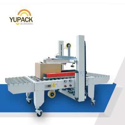 China GARMENT YUPACK FXJ-5050E High Performance Adaptive Carton Sealer for sale