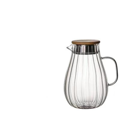 China Sustainable High Borosilicate Hot And Cold Water Jug Straight Glass Kettle With Handle for sale