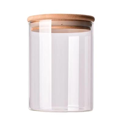 China Sustainable Kitchenware Clear Glass Spice Jar Durable Glass Storage Jar With Wooden Lid for sale