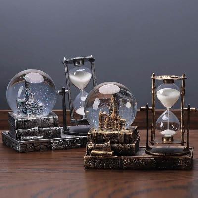 China Other Custom Resin Crystal Crafts Hourglass Decoration Snow Globe Music Box for sale