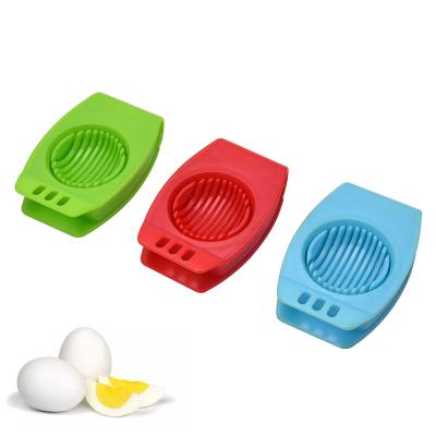 China Home Sustainable Hot Sale Used Green Boiled Egg Slicer With Metal Wires And Plastic Base for sale