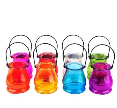 China Home decoration direct factory price colored glass lantern vase with metal handle for home decoration/glass lantern candle holder for sale