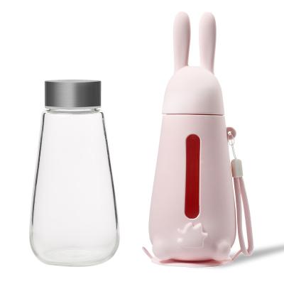 China Sustainable Anti-Skid Magic Never Fall Over Cup Rabbit Shape Heat Resistance Silicone Sleeve Sucker Bottle Cup Powerful Glass Water Bottle for sale