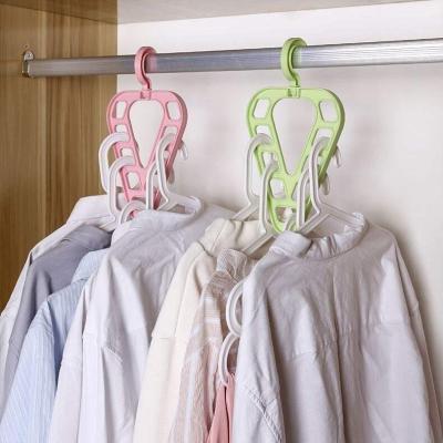 China New Design Non Slip 9 Hole Nine Holes Modern Triangle Multi-Function Magic Space Saving Rack Rack Cabinet Plastic Cloth Hangers for sale