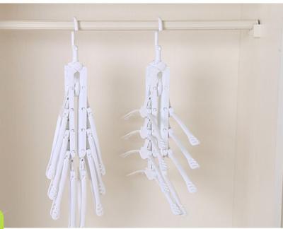 China Minimalist 8 in 1 Magic Hanger for Space Saving Slip 8 Foldable Tiers Non Rotating Plastic Magic Clothes Hanger for sale