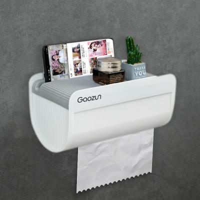 China Traditional Punch Free Bathroom Tissue Roll Paper Holder Wall Mounted Holder With Phone Shelf Phone Holder Moble Tissue Box Storage Dispenser for sale