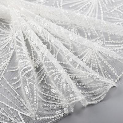 China Viable Custom Lace Beads White Mesh Beaded Embroidered Sequin Bridal Fabric Wedding for sale