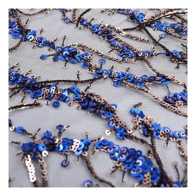 China Water Soluble Unique Luxury Design African Sequin Mesh Embroidery Fabric Gorgeous Royal Blue Tassel Sequin Fabric for sale