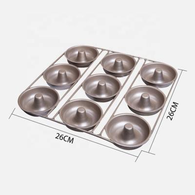 China Sustainable 9 Holes Carbon Steel Donut Baking Tray Pacifier Shaped Cake Baking Pan For Kitchen Gold And Black for sale