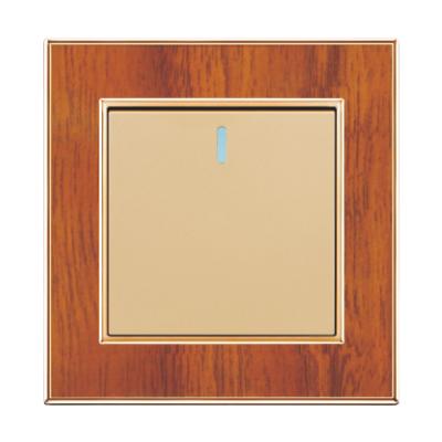 China UK Standard Competitive Price UK Standard Wiring Accessories Wood Grain With Gold Plated Frame One Strip One Way Wall Switch for sale