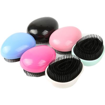 China New Beauty Hair Comb Comfortable Portable Soft Hair Care Plastic Egg Shaped Comb for sale