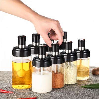 China Sustainable Glass Seasoning Bottle Cooking Salt Oil Storage Bottle Spice Jars Container Set With Spoon Brush for sale