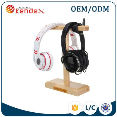 China Supermarket best selling wooden earphone stand earphone display stand made by wood with high quality for sale