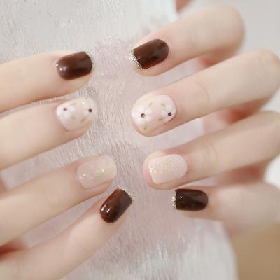 China Decorate Cute Short Square Artificial False Nail Glitter White Flower Finger Nail Brown Press On Nails For Daily for sale