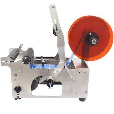 China Semi Automatic Manual Plastic Adhesive Sticker Label Food Round Bottle Labeling Machine for sale