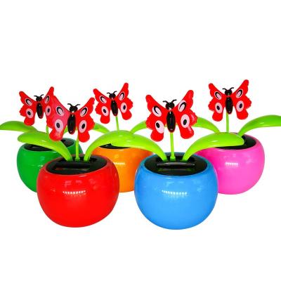 China Toy Gift Solar Powered Flip Battery Flower Automatic Flap Dancing Solar Flower Without Flower For Car Decor for sale