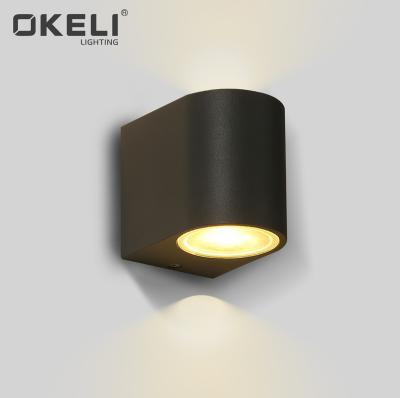 China Replaceable design for outdoor led bulb OKELI wall light modern style for home waterproof IP54 led up and down lamp for sale