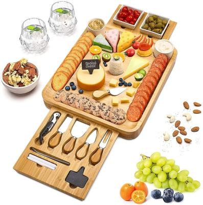 China Sustainable Housewarming Bamboo Cheese Cutting Cutting Board Serving Board Acacia Charcuterie Set With Cheeseknife for sale