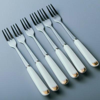 China Viable Pieces Flatware Metal Stainless Steel Fork Cake Handle Porcelain Ceramic Cutlery Set Tea Spoon Mini Fruit Fork for sale