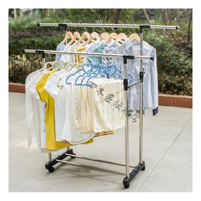 China Modern Customization Shop Shoes Floor Bipolar Telescopic Clothes Rack To Dry Clothes With Wheels Metal for sale