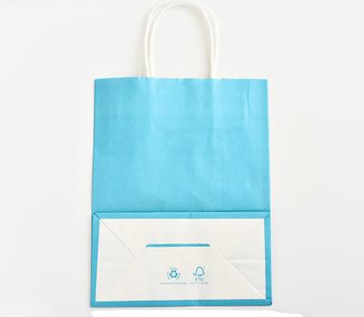 China Blue Color Printed Kraft Paper Bags Customzied Logo With Twisted Paper Handle for sale