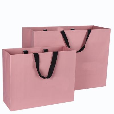 China Die rosa lamellierte Farbpapptasche druckte Luxus für den Einkauf/Geschenk zu verkaufen