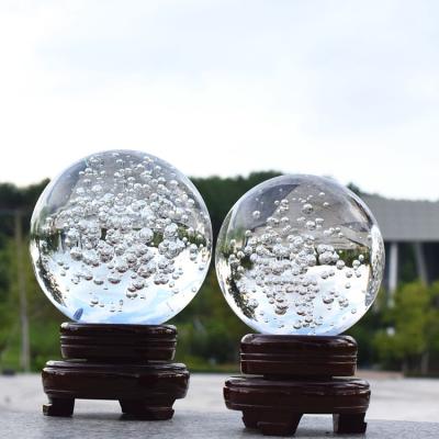 China Wholesale Europe Products 60mm 80mm Crystal Glass Ice Slot Bubble Ball With Wooden Base Suitable For Wedding Hotel Home Decoration for sale