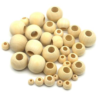 China Natural Unfinished Wooden Bead Wholesale Price Large Wooden Hole For Craft for sale