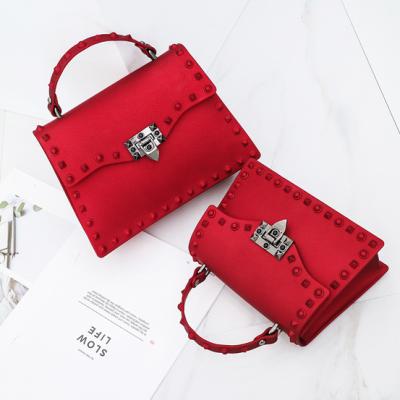 China Messenger bags 2021 new arrival matte frosted jelly women handbag, rivet bag, casual and soft one shoulder messenger carry bags for sale