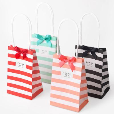 China paper & Wholesale White Color Cardboard Stripe Color Cardboard Gift Wrapping Bag Mini Portable Small Candy Bag Customized for sale