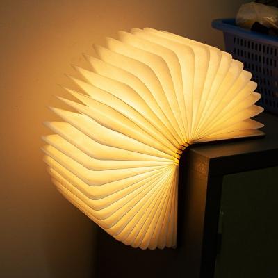 China Modern Drop Shipping Creative Colors 3D Book 5V USB Portable Wooden Night LED 5V USB Rechargeable Desk Table Lamp Foldable Lamp for sale