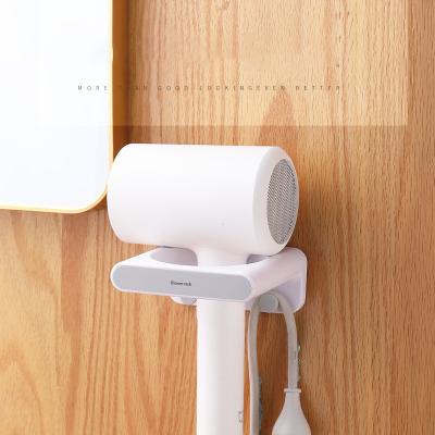 China Convenient Plastic Easy Stocked Install No Trace Stickers Hair Dryer Holder Stand for sale