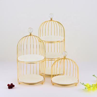 China Luxury Gold Ceramic Metal Cake Stands Tray Cake Turntable Holder Wedding Dessert Table Display Cake Stand with Circle Garland for sale