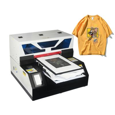 China Hot Sale Hotels A4 Digital DTG UV Flatbed Printer Direct to Garment T-shirt Textile Impresora DTG Cotton for sale