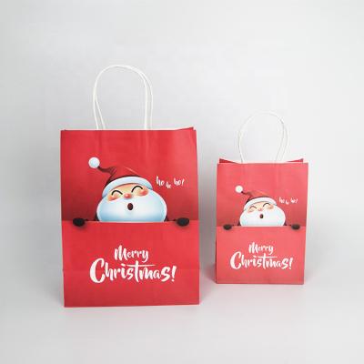 China 2021 Recyclable Santa Claus Fancy Cute Pattern Red Bulk Christmas Candy Kraft Paper Gift Bags for sale