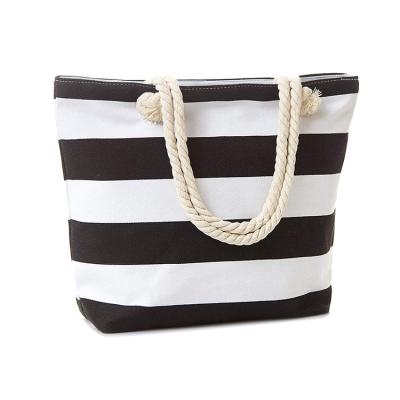 China Customized Eco-friendly Exquisite Color Design Pattern Canvas Multifunctional Stripe Handbag Ladies Handbag Black And White Beach Bag for sale