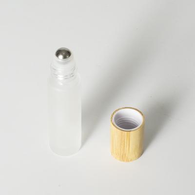 China Wholesale Luxury Refillable 10ml Essential Oil Glass Refillable Frosted Bottles With Steel Ball With Bamboo Lid for sale