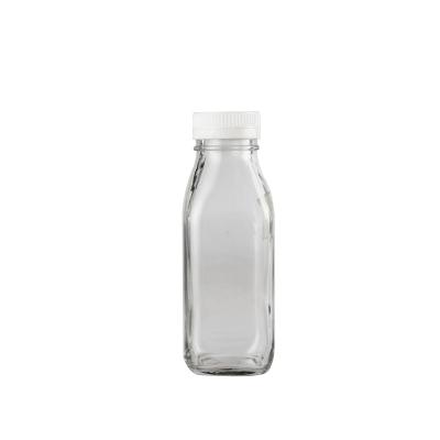 China Clear Square Empty Beverage 500ml 1000ml Glass Milk Bottles With Plastic Caps Juice Glass Bottles for sale