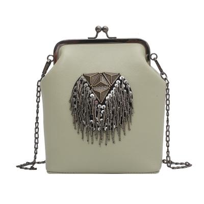 China 2021 Lady's new fashion tassel single shoulder vintage bags western women chain cross body bucket handbag ladies purse and purse for sale