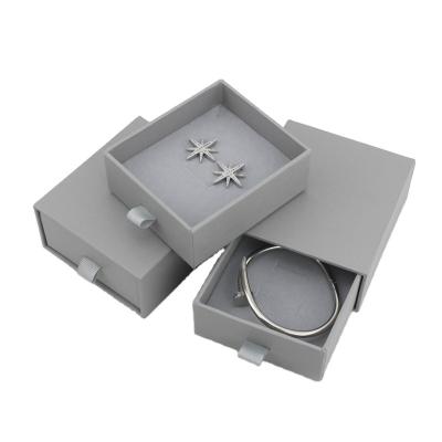 China Biodegradable Custom White Velvet Drawer Jewelry Packaging Paper Box With Handle for sale