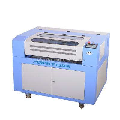 China Deep spotting carbon dioxide engraving machine with 600mm*400mm processing area can be equipped with automatic lifting table for sale