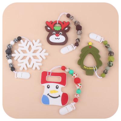 China Milk Teeth Raising Christmas Series Nipple Chain Baby Teether Set Santa Printed Silicon Beads Baby Bpa Teether for sale