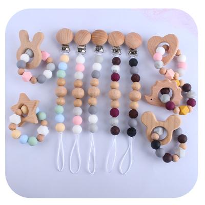 China Toy Amazon New Baby Pacifier Teethers Soft Wooden Silicone Baby Teether Beech Teether Animal Toy for sale