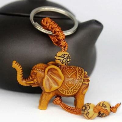 China R014 1 PCS TRENDY Elephant Key Chain Fishing Wood Carving Unique Key Chain For Giving Gifts Pom Pom Cute Keychain Stainless Steel for sale