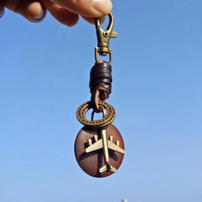 China New FASHIONABLE Handmade Leather Key Chain Vintage R056 Log Bronze Airplane Car Pendant New Key Chain for sale