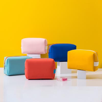 China Comfortable Cool Pu Leather Waterproof Portable Travel Candy Color Makeup Cosmetic Bag for sale